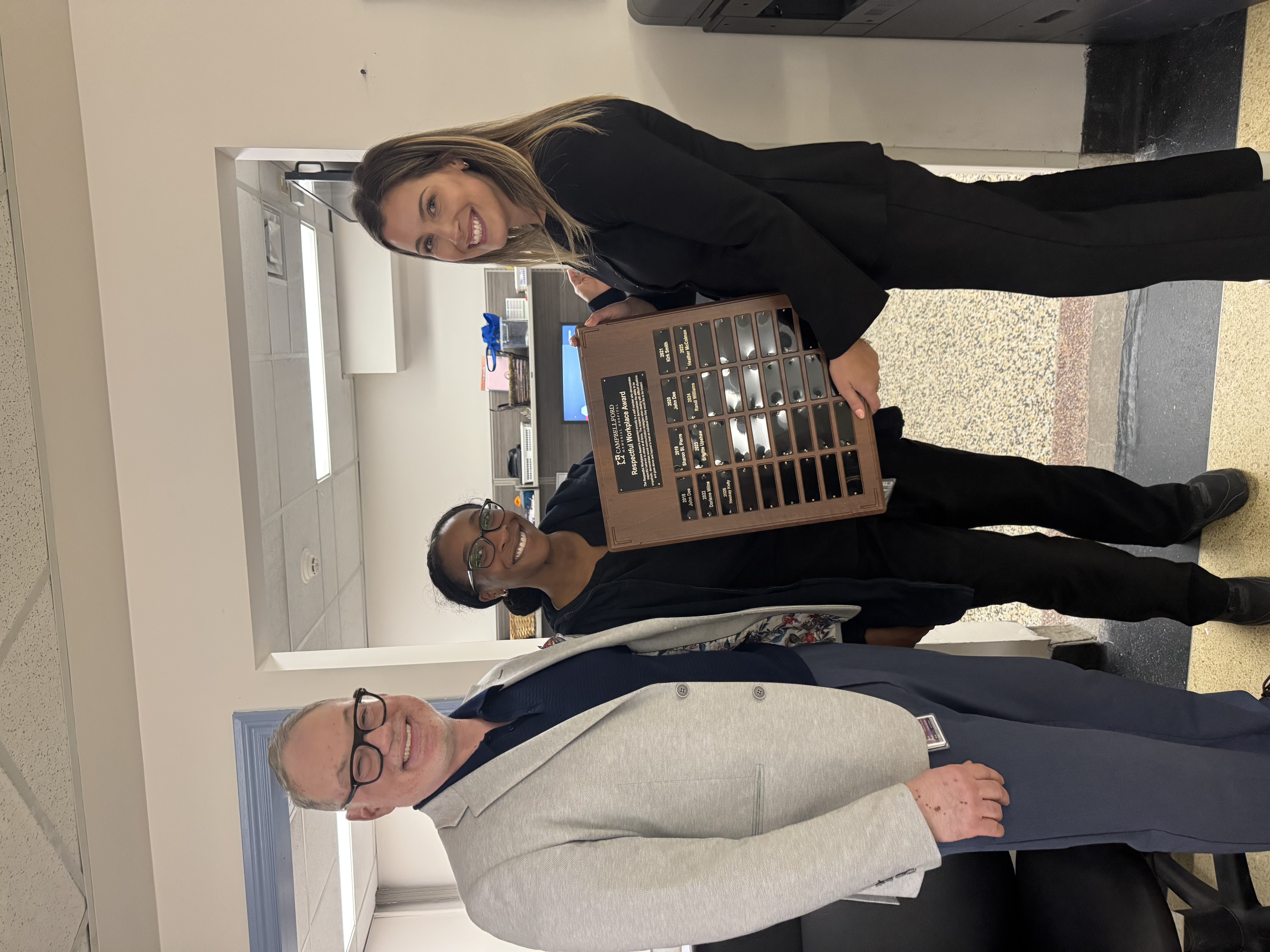Neekay Kelly receiving award